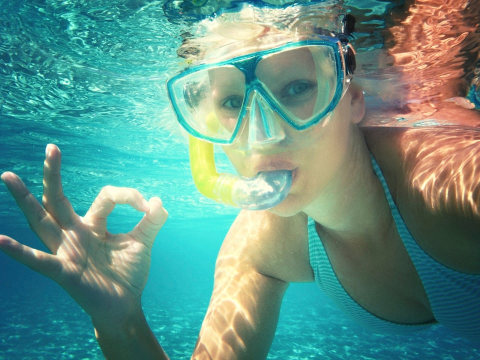 Young visitor snorkeling among Florida reef fish